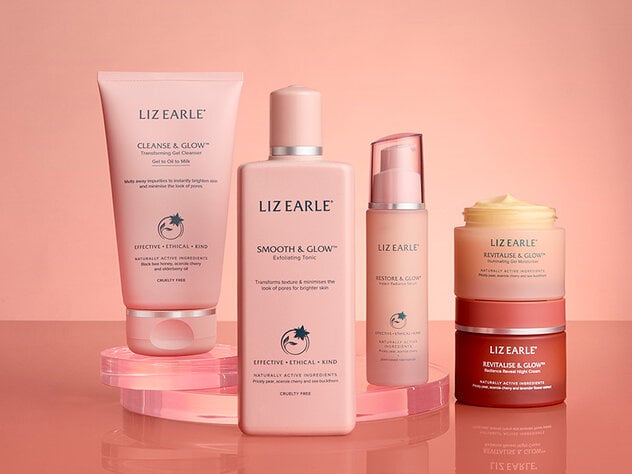 Liz Earle Beauty Co. Glow skincare range on a peach background