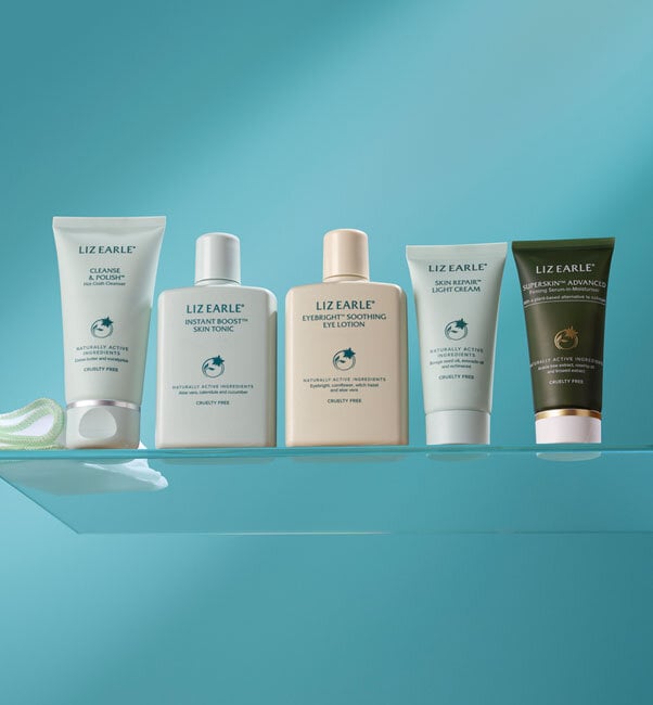 Liz Earle Beauty Co. travel size skincare products on a blue background