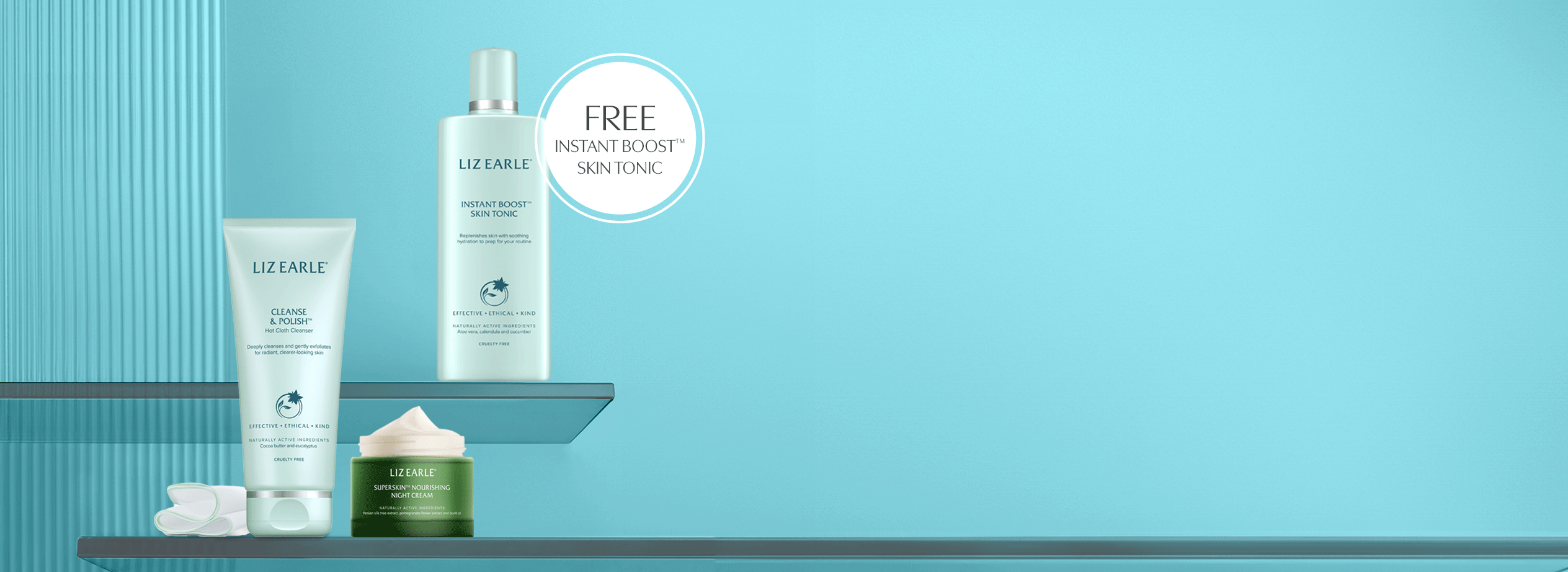 Liz Earle cleanser, moisturiser and instant skin boost tonic on a light blue background
